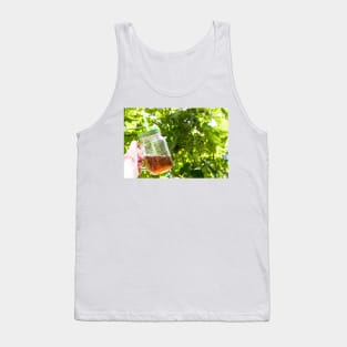 Hand holding a glass mug of cold tea Tank Top